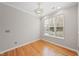 Bright dining room with hardwood floors and large window at 1920 Lost Ln, Raleigh, NC 27603