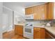 Bright kitchen with white appliances and light wood cabinets at 1920 Lost Ln, Raleigh, NC 27603