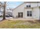 Back patio with sliding glass doors and two chairs at 1920 Lost Ln, Raleigh, NC 27603