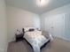 Bright bedroom with a full-size bed and double door closet at 1927 Channel St, Graham, NC 27253