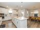 Bright kitchen features white cabinets and an eat-in area at 2371 Kettle Falls Sta, Apex, NC 27502