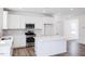 Modern kitchen with white cabinets, center island, and stainless steel appliances at 269 Sweetbay Tree Dr, Wendell, NC 27591