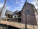 Rear of house showing unfinished porch and brick exterior at 274 Westhampton Dr, Pittsboro, NC 27312