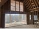 Unfinished interior view with exposed framing and a large window overlooking a treed landscape at 274 Westhampton Dr, Pittsboro, NC 27312