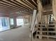 A spacious living room under construction boasts exposed wood framing and a staircase at 274 Westhampton Dr, Pittsboro, NC 27312