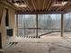 A screened porch under construction boasts scenic views and features a cozy fireplace at 274 Westhampton Dr, Pittsboro, NC 27312