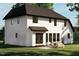 Rear view of a two-story home with patio and seating area at 2961 Forest Creek Ln, Mebane, NC 27302