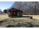 Two storage sheds and fire pit in the backyard at 3038 Bramblegate Dr, Mebane, NC 27302