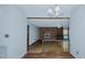 View of living room with brick fireplace from dining area at 3042 Marlborough Rd, Burlington, NC 27215