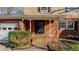 Brick front porch with steps leading to the entrance, featuring columns and landscaping at 3042 Marlborough Rd, Burlington, NC 27215