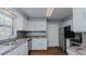 Updated kitchen with stainless steel appliances and white cabinets at 3042 Marlborough Rd, Burlington, NC 27215