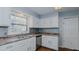 White kitchen cabinets, stainless steel appliances, and granite countertops at 3042 Marlborough Rd, Burlington, NC 27215