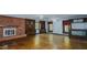 Living room features hardwood floors, a fireplace, and built-in shelving at 3042 Marlborough Rd, Burlington, NC 27215