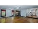 Open living room with hardwood floors and kitchen access at 3042 Marlborough Rd, Burlington, NC 27215