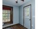 Spare bedroom with large window and door to outside at 3042 Marlborough Rd, Burlington, NC 27215