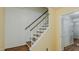 Indoor staircase with wooden steps and railing at 3042 Marlborough Rd, Burlington, NC 27215