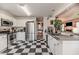 Kitchen with checkerboard floor and stainless steel appliances at 313 Cayman Ave, Holly Springs, NC 27540