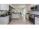 Modern kitchen with stainless steel appliances and granite countertops at 33 Sunburst Ct, Fuquay Varina, NC 27526