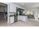Modern kitchen with white cabinets, granite countertops, and stainless steel appliances at 33 Sunburst Ct, Fuquay Varina, NC 27526
