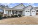 Gray house with front porch and two-car garage at 36 Mountain View Dr, Garner, NC 27529