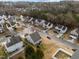 Aerial view showcasing a suburban neighborhood with houses and streets at 3838 Potecasi Dr, Raleigh, NC 27610