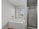 Bathroom featuring garden tub and separate shower at 3838 Potecasi Dr, Raleigh, NC 27610