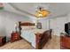 Bedroom with king-size bed, nightstands and ceiling fan at 3838 Potecasi Dr, Raleigh, NC 27610