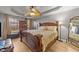 Main bedroom with a king-size bed and wood furniture at 3838 Potecasi Dr, Raleigh, NC 27610