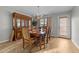 Dining room featuring a wood table and chairs, and a china cabinet at 3838 Potecasi Dr, Raleigh, NC 27610