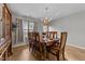 Formal dining room with wood table and chairs, and a chandelier at 3838 Potecasi Dr, Raleigh, NC 27610