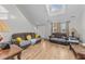 Spacious living room with hardwood floors, two couches, and a high ceiling at 3838 Potecasi Dr, Raleigh, NC 27610