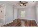 Spacious bedroom with hardwood floors and an ensuite bathroom at 411 E Green St, Franklinton, NC 27525