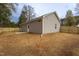 The backyard features a new wooden fence and gray siding, providing a private and modern outdoor space at 420 E Cedar Ave, Wake Forest, NC 27587