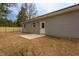 The backyard includes a concrete patio, gray siding, and newly installed wooden fence, offering a private outdoor area at 420 E Cedar Ave, Wake Forest, NC 27587