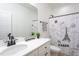 Well-lit bathroom with a modern vanity, stylish mirror, and tub-shower combination at 420 E Cedar Ave, Wake Forest, NC 27587