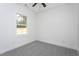 Clean bedroom offering neutral walls, plush carpeting, and a bright window view at 420 E Cedar Ave, Wake Forest, NC 27587