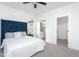 Cozy bedroom with a luxurious upholstered headboard, side tables, and ensuite bathroom access at 420 E Cedar Ave, Wake Forest, NC 27587