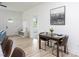Bright dining area featuring modern table setting, stylish decor, and sleek bench with storage at 420 E Cedar Ave, Wake Forest, NC 27587