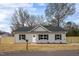 Charming single-story home with grey siding, black shutters, and a well-manicured front yard at 420 E Cedar Ave, Wake Forest, NC 27587