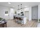 Modern kitchen with white cabinets, granite countertops, stainless steel appliances, and a convenient breakfast bar at 420 E Cedar Ave, Wake Forest, NC 27587