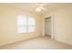 Bedroom with ceiling fan, window, and closet at 4304 Maggie Ct, Liberty, NC 27298