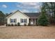 Ranch style home with stone accents and mature landscaping at 4304 Maggie Ct, Liberty, NC 27298