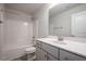 Bathroom with shower tub, toilet, and gray vanity with white countertop at 45 River Chapel Dr, Fuquay Varina, NC 27526
