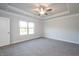 Spacious bedroom with carpet and large window at 45 River Chapel Dr, Fuquay Varina, NC 27526