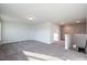Spacious bonus room with gray carpeting and lots of natural light at 45 River Chapel Dr, Fuquay Varina, NC 27526