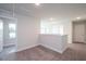 Upper level hallway with gray carpeting and access to bedrooms and bathroom at 45 River Chapel Dr, Fuquay Varina, NC 27526