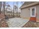 Outdoor patio area with bar stools, surrounded by natural landscaping enhancing leisure and enjoyment at 4716 Howe St, Durham, NC 27705