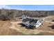 Aerial view of the home, showcasing its backyard, design and surrounding landscape at 4912 Hidden Pasture Way, Zebulon, NC 27597