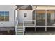 A bright back porch with stairs and screened-in area, perfect for outdoor enjoyment at 4912 Hidden Pasture Way, Zebulon, NC 27597