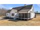 Backyard view highlighting the home's outdoor space and screened-in porch at 4912 Hidden Pasture Way, Zebulon, NC 27597